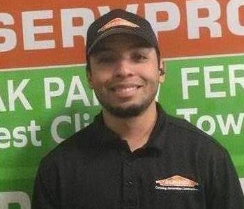 SERVPRO Employee Erick Standing in Front of Work Vehicle